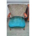 A 1940's Danish oak framed armchair with original upholstery in turquoise and geometric pattern.