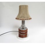 A circa 1970's table lamp in chromed metal and pine discs, crochet shade. 41cm high