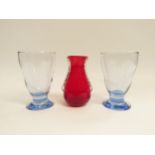A Whitefriars ruby red glass vase cased in clear and two Whitefriars blue sapphire glasses.