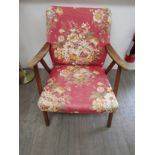 A 1940's Danish oak framed armchair with original upholstery in floral red fabric. 63.5cm x 74cm x