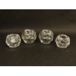Four Kosta Boda iceball candle holders by Ann Warff in two sizes, 6.5cm and 8cm