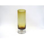 An amber glass cylindrical rose encased in clear with controlled bubble in base. Unmarked. 28cm high