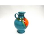 A West German Hutschenreuther jug designed by Renee Neue c1975, blue with orange and yellow glaze