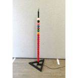 A standard lamp, formed from snooker balls on triangular base. 138cm tall including fitting