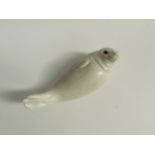 Paul Hoff for Gustavsberg - A ceramic figure of a Seal. Impressed marks to base. 9cm high x 24cm