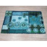 A Rya wool rug in blues and greens, 'Snowflake' design. Approx 158cm x 98cm