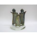 A Murano glass figural group, mother, father and child. Indistinct signature to the circular base.