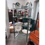 A late 20th Century chromed metal and glass open shelf display stand. 89cm x 40cm x 164cm high