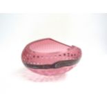 A Studio glass bowl by Jane Charles in pink overlay with clear circles, central band of flint with