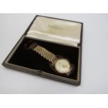 A 9ct gold Longines gentleman's wristwatch, circa 1950's, together with associated Longines case,
