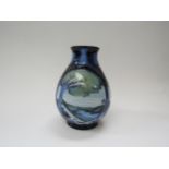 A Moorcroft 2003 vase by Emma Bossons, 'Knypersley' pattern in blues. Marks to base. 19cm high