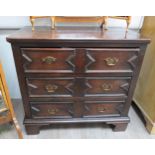 An 18th Century and later oak plank top chest of three long drawers having geometric moulded