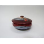 A Moorcroft Red Tulip pattern lidded bowl, 13cm diameter