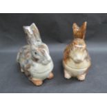 A pair of "Caugant" ceramic rabbit tureens, grey and brown, 20cm tall approximately