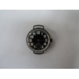 An early 20th Century silver, black faced wristwatch case marked 0.935