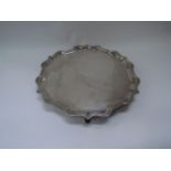 A C J Vander Ltd silver tray with shaped pie-crust edge, raised on four feet, Sheffield 1965. 37cm