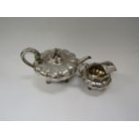 A Charles Thomas Fox & George Fox silver melon shaped teapot with floral finial and matching milk