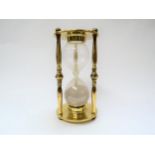 An early 20th Century brass sand timer, 25cm tall x 12.5cm diameter
