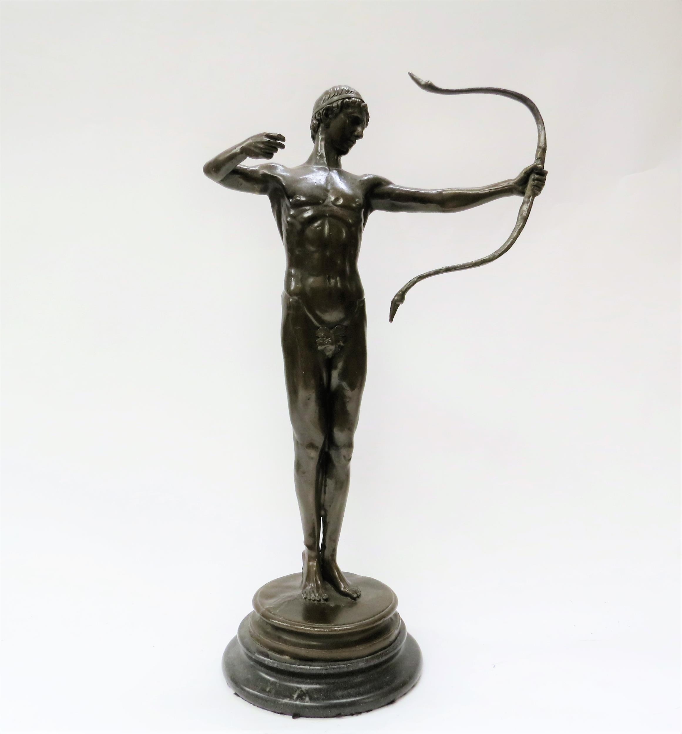 A bronze sculpture in the manner of Sir William Hamo Thornycroft's work depicting the champion Greek