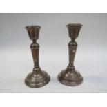 A pair of William Hutton & Sons Limited silver candlesticks with weighted bases, Birmingham 1918 (