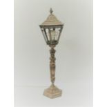 A cast copperized table lamp in the form of an old street light with scroll and mask detail, 70cm