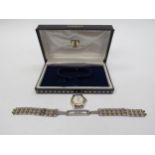 A ladies Tissot Ballade wristwatch with calendar and Roman numerals, strap detached in box with an
