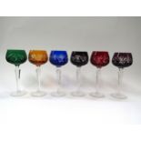 A Harlequin set of six Hock wine glasses of various colours with cut & overlay bowls, cut stems
