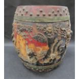 A 19th Century Chinese wooden rice barrel with high relief decoration, multiple areas of damage