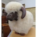 A footstool as a sheep with fleece body, dark stained wood face and feet, 44cm tall