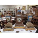 A late 19th Century Ormolu clock garniture with serves style porcelain panels, damage to feet. Clock