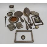 A box containing miscellaneous silver items all with damage, hand mirror and brush, cigarette cases,