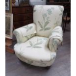 A Victorian open armchair with silk bamboo and flower decorated upholstery