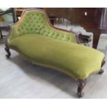 A Mid 19th Century rosewood chaise-longue with green velour button back upholstery, carved