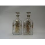 A pair of Georgian gilt decorated decanters