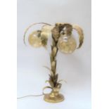 A 1970's brassed metal table lamp as a palm tree with three pale amber glass globe shades 72cm high
