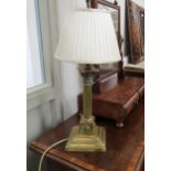 An early 20th Century brass Corinthian column form table lamp base with cabochon detail, a/f, 54cm