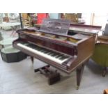 A John H. Crowley, London, baby grand piano stamped 4095. Retailed by sole agents, Wolsey & Wolsey