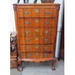A Walnut tall shaped front chest of six drawers, on claw feet, 145cm x 88cm x 46cm