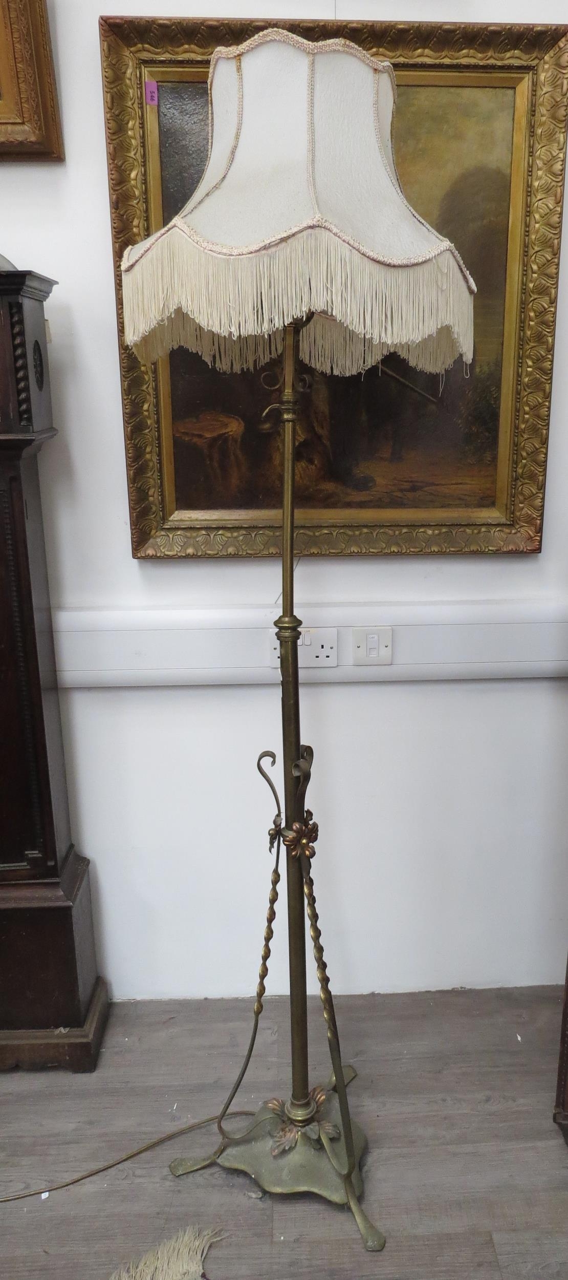 A late Victorian / early Edwardian telescopic Art Nouveau standard lamp with tasselled shade,