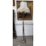 A late Victorian / early Edwardian telescopic Art Nouveau standard lamp with tasselled shade,