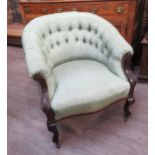 A 19th Century button back tub chair with watered silk upholstery, the frame with scroll acanthus