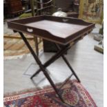 A Georgian mahogany butlers tray with turned folding stand, crack to tray, 85cm tall x 73cm x 56cm