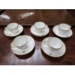 Five matching cups and six saucers, incised twist pattern with Chantilly sprig decoration, puce