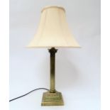 A bronzed metal table lamp base in the form of a Corinthian column, stepped base