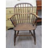 An 18th Century Windsor hoop back country chair, figured elm seat, H stretcher base