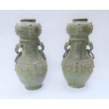 A pair of Chinese archaic style vases with ring handles, no bases, 35cm high