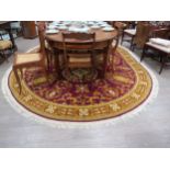 A Woodward Grovenor Axminster design 21/19001 80% wool rug with tasselled edge, approximately