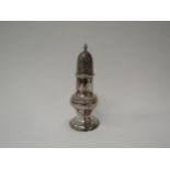 A George III silver baluster sugar castor with monogram to front circular footed base. Dents present