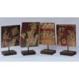 Four Thailand painted wooden panels of figures on stands, largest panel 24cm x 19cm