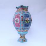 A late 19th/early 20th Century Chinese Famille Rose lantern with bowed and faceted panels, pierced